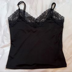 Perfect Condition, Never Worn. Slim Fitting Crop Top. Material Is Spandex So It Stretches. Feels Smooth. Comes With Adjustable Straps! Thick Lace Trim On Top. Ask Any Questions! 95% Polyester, 5% Spandex Black Stretch Camisole For Night Out, Stretch Black Camisole For Night Out, Stretch Elastane Camisole For Night Out, Night Out Elastane Camisole With Built-in Bra, Night Out Camisole With Built-in Bra, Forever 21 Fitted Cami Top, Fitted Cami Tops From Forever 21, Fitted Cami Tops By Forever 21, Forever 21 Fitted Top With Built-in Bra