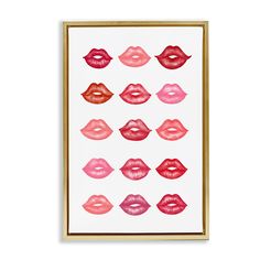 a framed print with pink and red lipstick on it's lips in different shapes