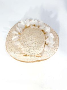 For Sale on 1stDibs - 1950s cream-colored starched lace picture hat with handmade french silk flowers, velvet trim, and bow accent. This hat is meant to be worn with a hat pin Vintage Cloche Hat For Garden Party, Vintage Costume Hats For Garden Party, Vintage White Costume Hat For Formal Occasions, Vintage Mini Hats For Kentucky Derby Garden Party, Vintage White Formal Costume Hat, Vintage Hats For Royal Ascot Formal Occasion, Vintage Hat For Royal Ascot Formal Event, Vintage Formal Hat For Royal Ascot, Vintage Cloche Hat For Kentucky Derby And Garden Party