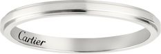 a white gold wedding ring with the word carrier engraved on it