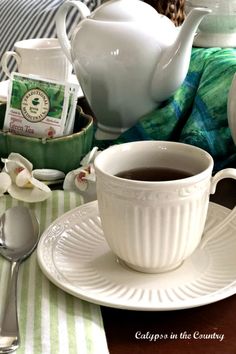 White tea cup and tea pot with green and blue napkins and decor. Blue Dinner Party, Country Tea Party