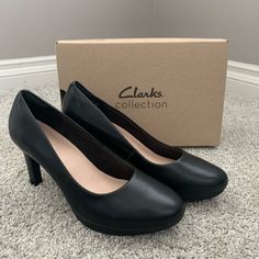 New Clarks Ambyr Joy High-Heeled Comfort Pumps - Black Leather - Size 8 1/2 Brand New In Box *Few Minor Scuffs From Being In Box - Shown In Last 3 Photos With Its Soft Toe Shape And Straightened Heel, The Ambyr Joy Has A Modern Yet Refined Look. Built To Be A Timeless Classic, Its Superior Underfoot Comfort And Striking Aesthetic Make It Perfect For All Occasions. These Shoes Combine The Best Of Both Worlds, Offering A Classic Silhouette That Is Crafted With A Supportive Platform And The Ultimat Synthetic Round Toe Heels For Business Casual, Synthetic Heels With Round Toe For Business Casual, Medium Width Faux Leather Court Shoes For Work, Faux Leather Court Shoes For Work, Casual Synthetic Heels For Work, Casual Faux Leather Heels For Office, Casual Faux Leather Office Heels, Black Casual Court Shoes For Work, Casual Black Court Shoes For Work