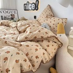 an unmade bed with teddy bears on it