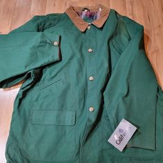 Vintage California Green Men's Collared Long Sleeve Button Up Coat Size 2xl. Good Pre-Owned Condition. Please See The Picture For Reference On The Conditions. Green Long Sleeve Utility Jacket For Hunting, Casual Hunting Outerwear With Pockets, Casual Long Sleeve Hunting Sport Coat, Casual Long Sleeve Sport Coat For Hunting, Classic Cotton Sport Coat With Buttons, Green Single Breasted Cotton Outerwear, Green Single-breasted Cotton Outerwear, Solid Cotton Sport Coat With Button-up Front, Outdoor Cotton Outerwear With Buttoned Pockets