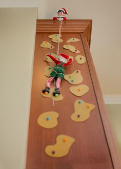 an elf on the shelf rock climbing