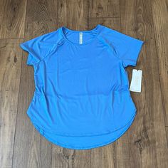 Nwt Woman’s Blue Rbx, Short Sleeve, Athletic Top With Wicking To Pull Moisture Away From Skin In A Size Large. Basic Blue Crew Neck Activewear, Blue Stretch Basic Activewear, Basic Blue Stretch Activewear, Blue Crew Neck Activewear For Summer, Blue Moisture-wicking T-shirt For Spring, Spring Blue Moisture-wicking T-shirt, Light Blue Short Sleeve Tops For Workout, Light Blue Stretch Moisture-wicking Top, Moisture-wicking Stretch Light Blue Tops