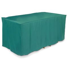 a green table cover sitting on top of a wooden table