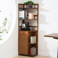 a wooden shelf with books and other items on it in a room next to a table