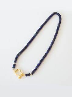 This Lapis Lazuli statement piece is made with 6mm rondelle style stones strung on Royal Purple silk and finished with an 18K Gold Filled Screw Clasp; beautiful clear CZ detail on head pin. At 17 inches in length, this piece is great for layering or letting it take all the glory and shine on its own. Lapis is latin for 'stone.' Lazuli meaning 'sky/heaven." Ancient lore states that this pyrite studded stone is the starry night sky shrunk down and that it holds all the knowledge of the universe. A Lapis Lazuli Necklace, Starry Night Sky, Purple Silk, Head Pins, Royal Purple, The Glory, Shine On, Night Sky, Lapis Lazuli