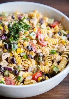 this southwest pasta salad is loaded with chicken, black olives, tomatoes, corn, and cilantro