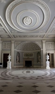 an ornately decorated room with white walls and ceilings