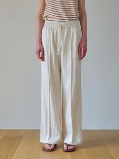 These wide-leg pants offer a versatile and modern style suitable for various occasions. It features the relaxed fit for comfortable wear experience.- Subtle pin tucks at the front for added flair- Drawstring detail on the inside of the hem for a jogger-style look- Elasticated waistband for comfort* The color may vary according to the monitor resolution. Cream Wide Leg Relaxed Fit Pants, Beige Wide Leg Pants With Relaxed Fit, Beige Wide Leg Pants With Straight Hem, White Linen Wide Leg Pants With Straight Hem, Drawstring Detail, Fashion Joggers, Wide Pants, Pin Tucks, Leg Pants