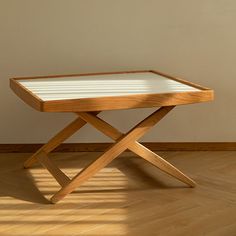 a wooden table sitting on top of a hard wood floor