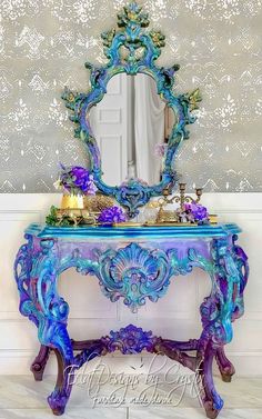 a blue and purple table with a mirror on it