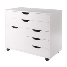 a white dresser with four drawers on wheels