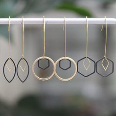 These dainty geometric, black earrings on a drop hook combine a mixture of matte gold and matte black geometric shapes. This equals dainty, gold earrings with a smidge of edge. Pair them with anything black, especially your evening looks! ⭐   Want to get 20% off your first order? Join the Style Club and get a coupon for 20% off sent to your inbox! https://bit.ly/ohsoetsycoupon.⭐ HYPOALLERGENIC MINIMALIST JEWELRY: Enjoy beautiful, hypoallergenic, minimalist jewelry without compromising your sensitive skin. Oh, So Fitting's geometric jewelry is made with nickel-free hooks and chains, so you can rest easy!  SIZING: - Oval = 5.3 cm - Circle = 5.2 cm - Hexagon = 5.1 cm GOOD TO KNOW: - They are lightweight with gold plated, hypoallergenic hooks. - The price is for a single pair of earrings CARE: Minimalist Jewelry Necklaces, Minimalist Black Earrings With Ear Wire, Black Minimalist Ear Wire Earrings, Minimalist Black Linear Earrings For Gifts, Minimalist Black Linear Earrings As Gift, Minimalist Black Drop Earrings, Minimalist Black Linear Drop Earrings, Modern Black Geometric Earrings, Black Geometric Jewelry