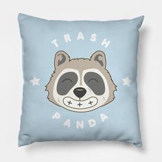 a blue pillow with a raccoon face and the words trash panda on it