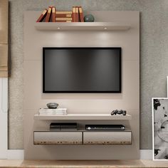 a living room with an entertainment center and bookshelves on the wall above it