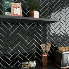 a toaster sitting on top of a counter next to a shelf filled with food