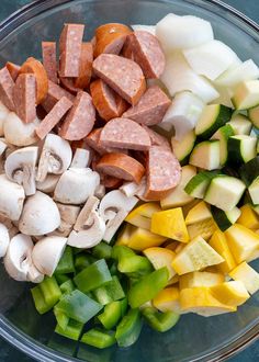 chopped vegetables and meats in a glass bowl