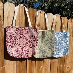 Barn Swallow Tote Bags These are hand-sewn limited edition tote bags made with my screen printed Barn Swallow Bandana in three color-ways. The color-ways are Bluebell, Ruby and Heather. The inside of the bags are lined with cotton canvas and the handles are cotton webbing.  These tote bags are a great eco-friendly option for carrying school books, laptops, groceries, or anything else you need. The handles fit comfortably over your shoulder and the bottom of the bags have box corners to fit more inside. These tote measure approximately 15x16x3" with 11" long handles. The outside of the bags are created from two of my hand screen printed bandanas. The art is screen printed in a water-based ink on a 100% cotton bandana. The Barn Swallow design is one of my original illustrations and these are Recyclable Tote Bag For Everyday Use, Beige Recyclable Bag For Everyday, Recyclable Everyday Shoulder Bag, Eco-friendly Canvas Tote Bag With Removable Pouch, Eco-friendly Red Canvas Bag For Daily Use, Large Reversible Bags For Everyday Use, Eco-friendly Red Tote Bag, Large Reversible Bag For Everyday Use, Eco-friendly Red Bag For Everyday Use