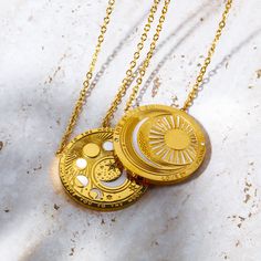 Our Celestial Coin Medallion Necklace—a captivating accessory inspired by the celestial wonders of the universe. This necklace features a stunning coin-shaped pendant crafted in gold, adorned with celestial motifs that evoke a sense of mystery and magic. With three distinct styles to choose from—moon phase, sun and moon, and evil eye—this necklace allows you to express your unique style while embracing the celestial energies that surround us. Character Accessories, Celestial Motifs, Gemstone Candles, Mystical Necklace, Boho Tote Bag, Zodiac Rings, Wiccan Jewelry, Zodiac Bracelet, Evil Eye Earrings