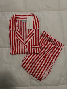 red and white striped pajamas on a bed