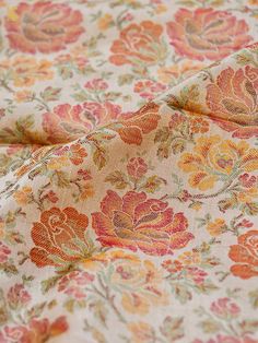 an orange and pink floral print fabric