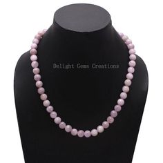 Product Details : Item Code : DGC2805Gemstone Name :  KUNZITEChain Style : BEADEDBeads Shape : SMOOTH ROUNDBeads Size :  9 MM ApproxLength : 18" Inch ApproxWeight : 270 Cts. ApproxCustomization : **Available**Please Feel Free To Contact If You Have Any Query. Elegant 8mm Round Beads For Gems And Cabochons, Elegant 8mm Round Beads For Jewelry Making, Wedding Necklace With Natural Round Stone Beads, Wedding Necklace With Round Natural Stones, Round Pearl Necklace With Gemstone Beads For Gifts, Elegant Round Crystal Necklaces With 8mm Beads, Wedding Beaded Necklaces With Round Natural Stones, Wedding Beaded Necklaces With Natural Round Stones, Wedding Beaded Necklaces With Natural Stones