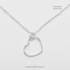 "We create 925 sterling silver jewelry for you. This simple Open Heart design celebrates the spirit of love.   So many people are afraid to open their hearts to love. Perhaps you need an Open Heart. Versatile and Minimalist Design Charm: 1.2 cm Chain: 16\" or 18\" Clasp type: spring ring All made from 925 sterling silver. No nickel or steel. Not silver plated.  Choose the length of your sterling silver chain. Matching Earrings: https://www.etsy.com/uk/listing/749000671 Honey Bee Necklace: https://www.etsy.com/uk/listing/729394742 More Necklaces: https://www.etsy.com/uk/shop/JewelleryCraftbyKC?ref=simple-shop-header-name&listing_id=729394742&section_id=27383128 Sterling Silver Earrings: https://www.etsy.com/uk/shop/JewelleryCraftbyKC?ref=simple-shop-header-name&listing_id=729394742&section_ Minimalist Sterling Silver Heart Pendant Necklace, Minimalist Sterling Silver Heart Necklace With Round Pendant, Sterling Silver Heart Necklace For Everyday, Everyday Sterling Silver Heart Necklace, Valentine's Day Heart Pendant Necklace With Sterling Silver Clasp, Handmade Sterling Silver Heart Pendant Jewelry, Handmade Heart Shaped White Gold Jewelry, Silver Open Heart Everyday Jewelry, Silver Open Heart Jewelry For Everyday