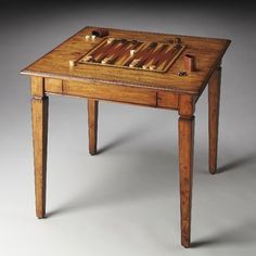 a small wooden table with drawers on it