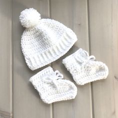 "Size 3 to 6 months. This is a little baby hat and booties set, crocheted in white in a thicker weight acrylic yarn. The hat will fit up to a 18\" (46 cms) head circumference, and is 6\" (15 cms) in depth from crown. The sole of the booties measures 4\" (10 cms). Machine wash and dry, short gentle cycle, low heat, or hand wash and dry flat. Please read my policies and FAQ for more information. To view more of my items ....   lurayknitwear.etsy.com Shipping will be combined for multiple items wit Infant Crochet, Crochet White, Knitted Baby Cardigan, Knitted Baby Clothes, Baby Coat, Shenandoah Valley, Crochet Set, Baby Hands, Baby Yellow