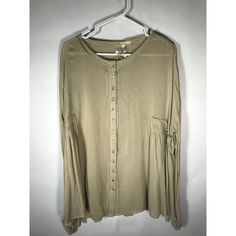 Easel Tan Women's Blouse Very Flowy With Raw Edge Hem Around Neck And Down Front. Features Pretty Iridescent Shell Like Buttons. This Is A Very Loose Fit. Gauze Type Fabric. New With Tags. Size Small. Beige Rayon Tops For Day Out, Green Rayon Long Sleeve Tops, Green Long Sleeve Rayon Top, Beige Rayon Top For Spring, Iridescent Shell, Tan Woman, Blouse Long Sleeve, Shell Buttons, Raw Edge