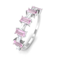 Product Details Embrace modern elegance with this Half Eternity Ring. The alluring Pink Tourmaline gemstone, exude a contemporary charm, complemented by the brilliant sparkle of Moissanite gemstones set horizontally. Celebrate your cherished bond with this captivating Pink Tourmaline and Moissanite ring, a perfect blend of style and sentiment. Product Information SKU SHP-RINGS032222505 Weight 1.68 gm (Approximate) PINK TOURMALINE INFORMATION No.of Stones 10 Pieces Total Weight 1.40 Carat (Approx Modern Multi-stone Baguette Cut Rings, Modern Multi-stone Diamond Ring For Wedding, Modern Pink Diamond Rings, Modern Pink Gemstone Rings, Modern Baguette Cut Rings With Accent Stones, Modern Sapphire Ring With Prong Setting, Modern Pink Ring For Anniversary, Modern Pink Rings For Wedding, Half Eternity Ring