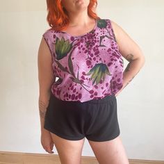 "This is sheer floral tank blouse from the 1990s. It features a lovely painterly print in purple and green. No label tag Fits 3-4XL Bust 51\" Waist 50\" Length 27\" Polyester Excellent condition" Summer Floral Print Purple Blouse, Summer Purple Floral Print Blouse, Purple Floral Print Summer Tank Top, Summer Purple Floral Print Tank Top, Vintage Purple Floral Print Top, Vintage Purple Top With Floral Print, Purple Vintage Floral Print Tops, Relaxed Fit Purple Tops With Floral Print, Purple Sleeveless Blouse For Spring