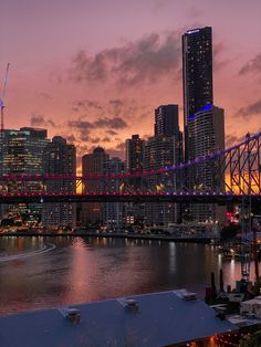 the city skyline is lit up at night