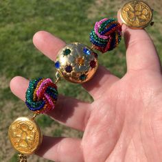 Who’s Ready To Party?!?! This Amazing Piece Can’t Help But Make You Smile And Get Up And Dance! Beautiful Rainbow Seed Bead Earrings Flank A Golden Dome Of Multicolored Rhinestone Starbursts! Finished With Golden Coins And A Gold Toggle Clasp. Measures 8”. All Pieces Are Made With Vintage And Recycled Materials So Flaws Maybe Visible. I Try To Show Any Missing Stones In The Pictures. Please Feel Free To Ask Any Questions. Closures May Be Changed At No Cost. Please Specify What Type Of Closure Yo Multicolor Clip-on Party Jewelry, Bohemian Clip-on Jewelry For Parties, Beach Charm Bracelet, Golden Coins, Cat Charm Bracelet, Golden Dome, Artisan Bracelets, Leaf Bracelet, Repurposed Vintage