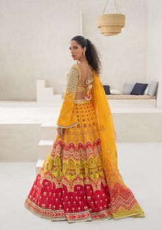 Turn heads at any musical event for the season with this bright ensemble. The choli is beautifully finished with geometric gota work and an accentuated neckline. The canary yellow printed lengha is touched with gota and stone work. The printed organza dupatta completes the piece in harmony Yellow Chanderi Sets For Reception, Designer Yellow Cutdana Sets, Designer Yellow Sets With Cutdana Detailing, Designer Yellow Sets With Cutdana, Yellow Anarkali Set With Mirror Work, Designer Yellow Sets With Gota Work, Yellow Chanderi Salwar Kameez For Reception, Yellow Anarkali Set With Gota Work For Navratri, Bollywood Style Yellow Sharara With Cutdana