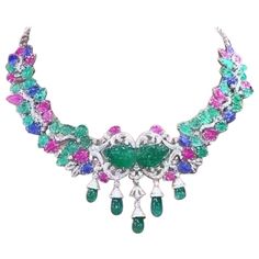 A master piece necklace , so magnificent , refined and chic style, for glamour ladies, by Italian designer, a very piece of art. Necklace come in 18k with 2 centre natural Untreated Carving Zambian Emeralds of 22 carats, extra fine quality; 29 pieces of Untreated Carving Zambian Emeralds of 26 carats, extra fine quality; 5 pieces of natural Zambian Emeralds in perfect drop cut of 24 carats; 10 pieces of Untreated Carving Burma Sapphires , extra fine quality, of 13 carats; 19 pieces of natural Untreated Carving Burma Rubies , extra fine quality, of 17 carats, and 585 pieces of natural diamonds in round brilliant cut of 6,43 carats, F color VS clarity, top quality. I can customize also length on request. Piece of high jewelry. Handcrafted by artisan goldsmith . Excellent manufacture and qual Rubies Necklace, Art Necklace, Master Piece, Zambian Emerald, Italian Designer, Sapphire Necklace, Zambia, High Jewelry, Italian Design