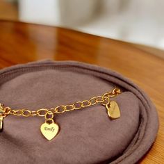 ✨ Searching for the perfect gift that speaks directly from the heart? Our Personalized Heart Charms Bracelet is the ideal way to celebrate the special women in your life--whether it's your mom, grandma, or wife! 💖 💍 Each bracelet is delicately crafted with love, featuring engraved name pendants on dainty heart charms. Customize it with the names of loved ones to create a truly unique piece that they'll cherish forever. Whether it's for Mother's Day, a birthday, or just because, this bracelet is a beautiful reminder of the bond you share. 🌸 🎁 Imagine the joy on her face as she unwraps this thoughtful gift, knowing it was made just for her. This isn't just a piece of jewelry; it's a symbol of love and connection that she can carry with her every day. Perfect for layering or wearing solo, Charm Bracelet For Best Friend Gift On Valentine's Day, Gold Charm Bracelet With Heart Charm For Mother's Day, Elegant Heart-shaped Bracelets For Best Friend, Gold Heart Bracelet With Charms For Mother's Day, Valentine's Day Heart Charm Bracelet For Best Friend, Valentine's Day Charm Bracelet For Best Friend, Mother's Day Gold Heart Bracelet With Charms, Name Bracelet With Heart Charm For Gift, Elegant Bracelets With Heart Charm For Personalized Gift