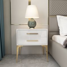 a nightstand with a lamp on it next to a bed