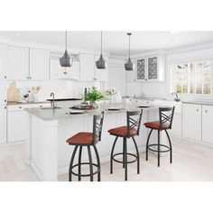 a kitchen with white cabinets and wooden stools in front of an island countertop