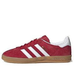 The adidas Gazelle Indoor 'Scarlet Gum' is a modern take on the classic 1979 Gazelle Indoor sneaker. Crafted with a soft suede upper and durable leather lining, the sneaker features a semi-transparent effect and the iconic 3-Stripes and metallic gold lettering for a timeless look. Perfect for any active lifestyle, this sneaker is sure to make a statement. The Gazelle Indoor series is inspired by the classic '79 Gazelle, with a modern twist. The 'Scarlet Gum' colorway is a vibrant red hue that will add a pop of color to any outfit. (SNKR/Skate/Light/Casual/Wear-resistant) High-top Adidas Suede Skate Shoes, Adidas High-top Suede Skate Shoes, University Red Adidas Lace-up Sneakers, Casual Adidas Logo Suede Skate Shoes, Casual Adidas Suede Skate Shoes, Casual Suede Adidas Skate Shoes, Adidas Suede Skate Shoes With White Sole, Adidas Suede Sneakers With Round Toe, Adidas Suede Sneakers With Logo