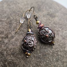 Morgan Earrings Exquisitely detailed 10mm puff coins of antiqued copper with a bronzed patina, enhanced with fire polished Czech glass. Extended length flattened French hook ear wires in antique bronze. Antique Gold Drop Earrings With Antique Finish, Vintage Bronze Earrings With Oxidized Finish, Bronze Vintage Earrings With Oxidized Finish, Ornate Bronze Metal Earrings, Nickel-free Antique Gold Copper Earrings, Antique Gold Nickel-free Copper Earrings, Antique Gold Copper Drop Earrings, Antique Gold Metal Earrings With Antique Finish, Antique Finish Copper Drop Earrings