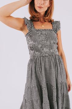 Get ready to dance the night away in our Midnight Serenade Dress. With a playful square neckline and a chic black and light gray gingham pattern, this dress is both stylish and comfortable. The smocking around the bodice provides a flattering fit while the midi length adds a touch of sophistication. Perfect for any occasion. Description Square neckline Black and light gray gingham pattern Smocking around entire bodice Midi length Sizing Approximate measurements: SIZE LENGTH BUST Small 47.5" 24" Nursing Friendly Tops, Nursing Friendly Dress, Plus Jumpsuit, Gingham Pattern, Exclusive Dress, Maternity Shops, Basic Dress, Tank Top Long Sleeve, Plus Dresses