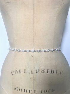 This delicate rhinestone and pearl bridal sash will add a soft touch of sparkle to your special dress.  Clear glass crystal, and pearl embellishment measures 1/4" in width and 18" in length.  Longer beading lengths are available in the drop down menu.  If you have any questions about sizing, please feel free to ask. Double faced satin ribbon sash measures 3/8" in width, with a total length of 90".  Please select your ribbon color from the drop down menu.  If you do not see the color that you nee Bridesmaid Belt, Bridesmaid Sash, Bridal Sash Belt, Special Dress, Wedding Sash Belt, Wedding Sash, Bridal Sash, Pearl Bridal, Wedding Belts