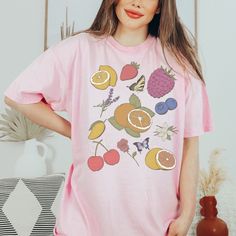 Step into a whimsical world with our Cottagecore Clothes Vintage Fruity Shirt. This preppy and cheerful garment features a delightful array of fruits, making it a perfect choice for those who love all things foodie and fruity. Crafted with comfort in mind, this Fruit T-Shirt is designed using high-quality, vegan materials that embrace the essence of nature. The vibrant colors and charming design of this Fruit Tee offer an aesthetic appeal that is both eye-catching and playful. Whether you're loo Trendy Shein Outfits, Summer Nyc Outfits, Casual Church Outfits Summer, Summer Bar Outfits, Dinner Outfits Summer, Summer Work Outfits Office Casual, Nyc Outfits Summer, Baddie Summer Outfits, Summer Work Outfits Office