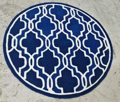 Enhance your space with this sophisticated round rug, featuring a striking navy blue base adorned with an intricate white geometric trellis design. Its timeless and elegant pattern complements a variety of décor styles, from modern to traditional. Ideal Placement: Living Room: Perfect as a stylish centerpiece or under a small coffee table. Entryway or Foyer: Adds a touch of class to welcome your guests. Bedroom: Ideal for placing near the bedside or in a reading nook. Office: Complements professional or minimalist decor while providing warmth. Material & Care: Crafted from durable and soft materials for long-lasting comfort. Easy to clean with regular vacuuming or light spot cleaning. This rug offers a blend of simplicity and elegance, making it an excellent choice for any space in need of Nook Office, Guests Bedroom, Geometric Trellis, Table Entryway, A Reading Nook, Navy Blue Rug, Trellis Design, Small Coffee Table, Elegant Pattern