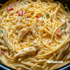 pasta with chicken and tomatoes in a bowl