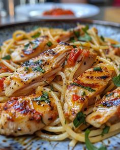 pasta with chicken and tomato sauce on a plate